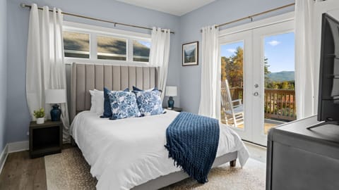 Master bedroom has access to back deck.