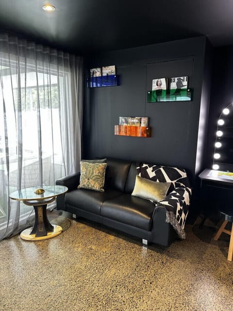 Lounge area and make up station where you can relax and read a magazine or watch the enormous TV.,