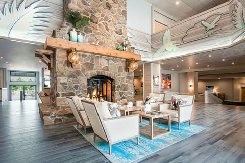 Unwind by the grand fireplace in a bright, airy lobby.