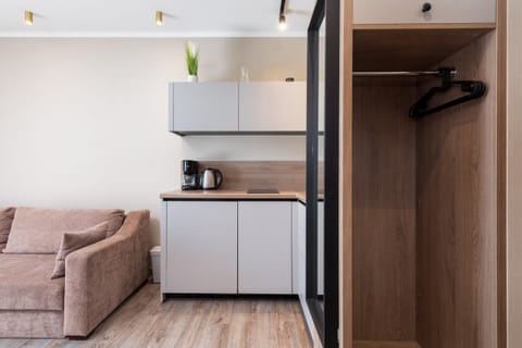 A wardrobe area with ample storage space and minimalist design, blending style with practicality.
