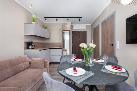 A fully equipped kitchen and dining area, offering functionality and a welcoming design.
