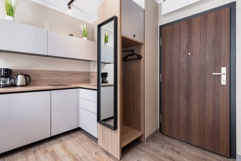 A closer view of the kitchen, highlighting its sleek cabinetry, appliances, and modern layout.
