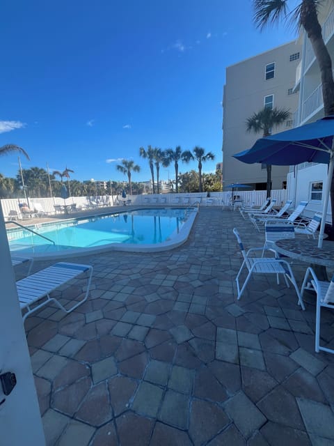 Pool is located on street side of the condo and accessible from the beach 