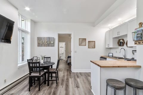 Open concept of dining area, living room & kitchen