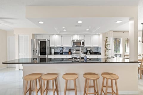 Have breakfast or a quick snack at our smooth marble kitchen isle