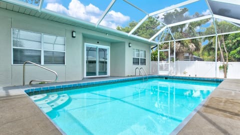 Experience pure relaxation with your very own lanai-covered pool oasis.