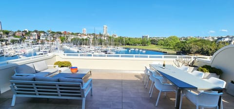 Private oversized outdoor terrace with harbour views.  Large umbrella.