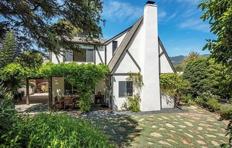 Backyard terrace with wisteria covered outdoor dining, gas BBQ, gas fire pit