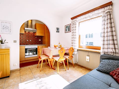 Furniture, Cabinetry, Window, Building, Table, Wood, Interior Design, Orange, Flooring, Chair