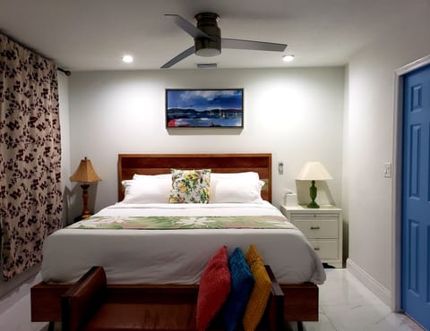 King bed, dresser, luggage rack, plenty of closet space with full mirror