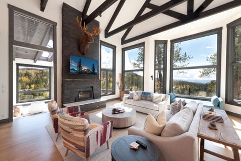 Main Living Space - TV, Wood Burning fireplace and amazing views from the floor to ceiling windows