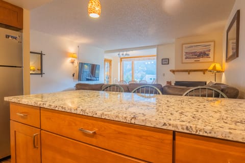 Bar stool area looking into living room.