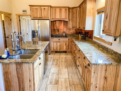 The well appointed Kitchen features ample counter space