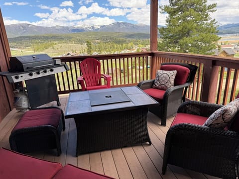 Outdoor deck with grill and fire table with stunning mountain views.
