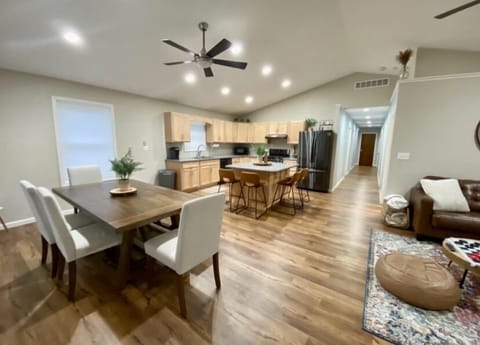 Open concept kitchen, dining  & living room space