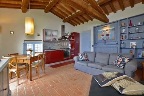 The living room with dining area and kitchen corner