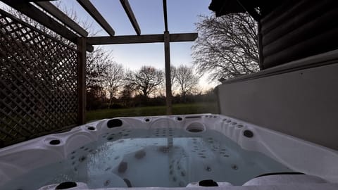 Private five person hot tub with privacy screen