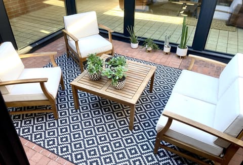 Cozy outdoor atrium provides another space to relax with family and friends.