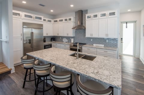 chef's kitchen and additional seating