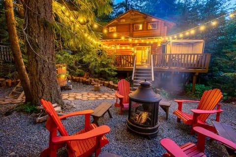 Beautiful outside area with sauna, cedar tub and fireplace.