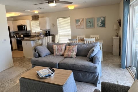 Open concept living room and kitchen with views of the gulf