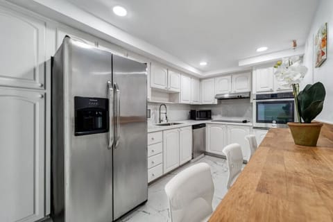 Fully equipped kitchen featuring premium appliances and elegant finishes for home cooking