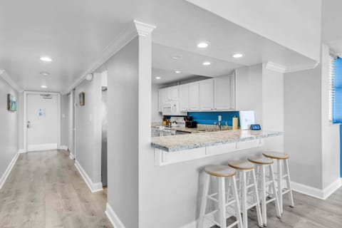 Updated kitchen with granite countertops and cooking supplies