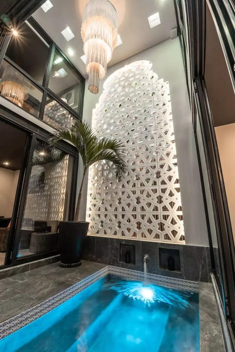 Enjoy 2x heated saltwater pools with 2-story Moroccan arches at the heart of the each living area, s (1)