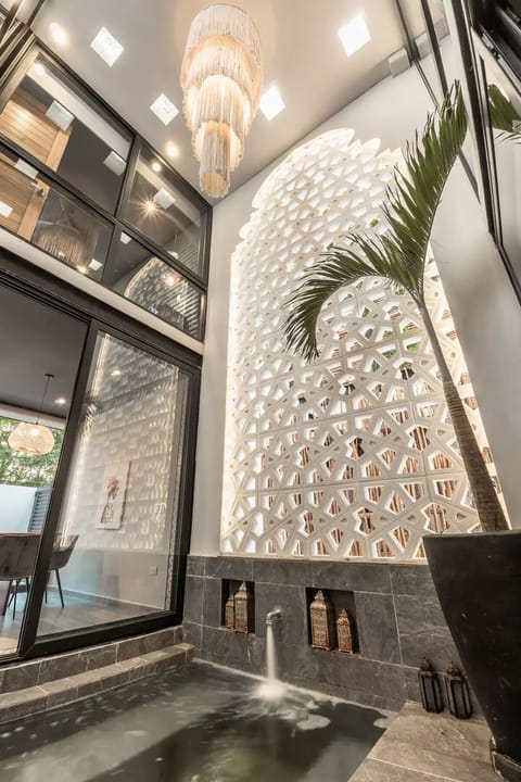 A heated saltwater pool with a 2-story Moroccan arch is the heart of the living area, surrounded by (1)