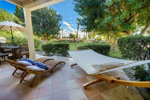 Enjoy the view of the golf course from the oversized hammock and lounge chairs