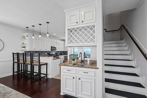 Lovely bar with sink makes it easy to service all your friends and guests.