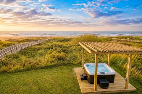 Luxury outdoor hot tub with private deck and panoramic marsh views, offering a peaceful coastal retreat near Galveston beaches.