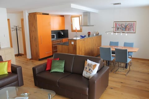 Looking at the comfortable kitchen and dining room