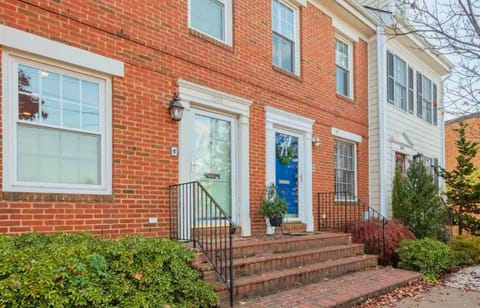 A classic and welcoming exterior with beautiful landscaping, perfect for a cozy and inviting stay.