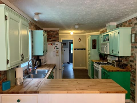 Adorable Kitchen w/ butcher block counters.
