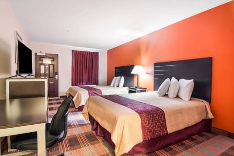 Stretch out on two plush beds after a busy day.