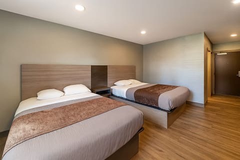 Unwind in a bright double room with plush beds.