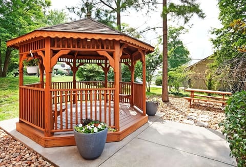 Unwind under the charming gazebo with peaceful garden views.