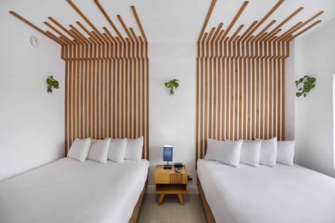 Drift off beneath sculptural wood detailing and cloud-soft pillows.