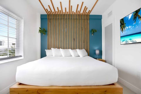 Sink into cloud-soft pillows framed by bold, modern design.