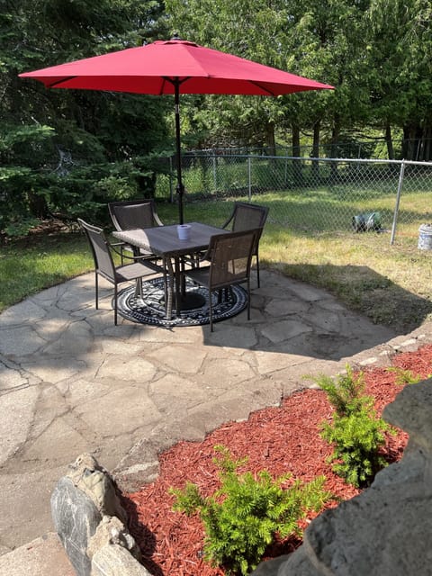 Back patio area with a dining set.