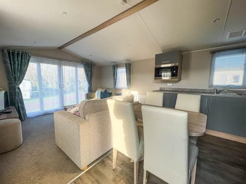 This expansive area seamlessly connects the kitchen, dining, and lounge areas, creating a wonderfully social and inviting atmosphere for everyone.