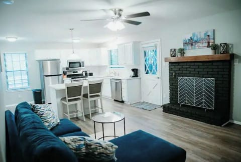 Family room attached to kitchen with gas fireplace and SMART TV

