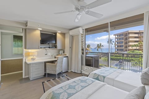 Bed can be one king or two single beds. 
 View of shared corridor, not a lanai. 