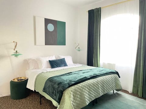 King Tuft & Needle bed with organic sheets and blankets.