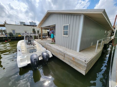 Back porch with room for docking up to 42’ boat and a beautiful view!