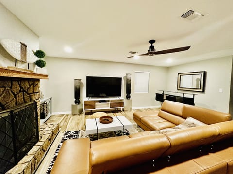 Beautifully designed living room with luxurious leather sectional.
