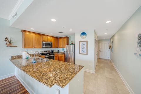 Fully equipped kitchen with granite countertops.