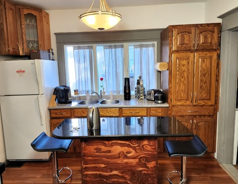 The kitchen island provides extra counter and eating space.