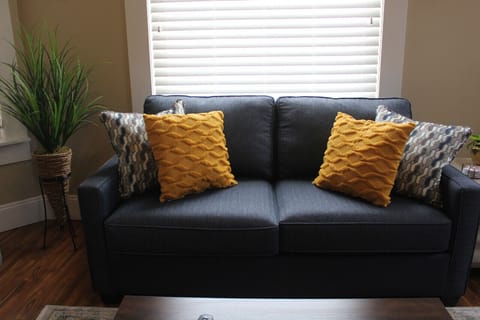 This inviting space is designed to create a sense of serenity and relaxation. The abundant natural light that floods the room accentuates the soothing color palette, creating an atmosphere of calm and tranquility.